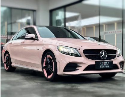 Today's sense of ceremony is given by a pink Mercedes